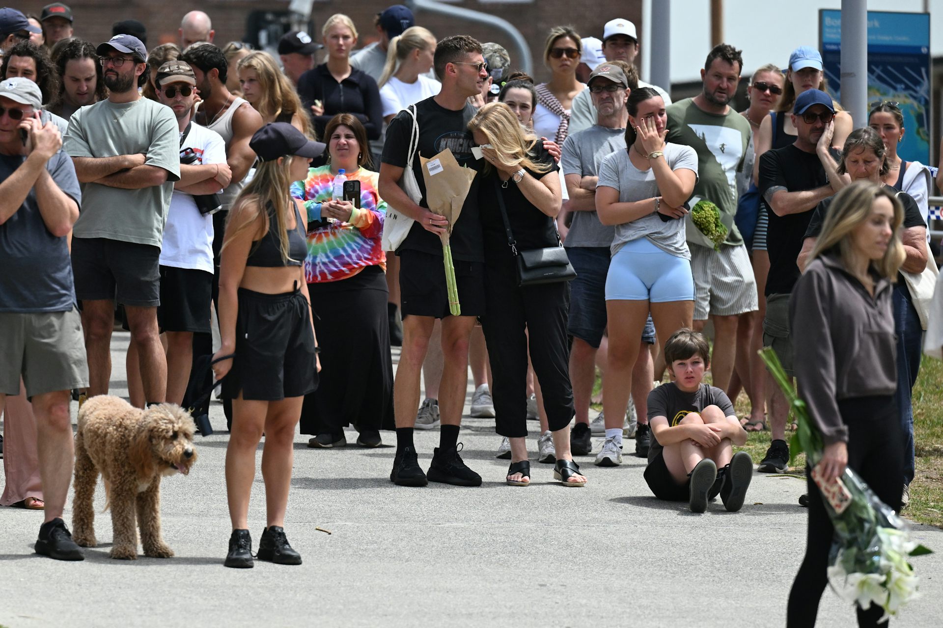 A crowd of mourners gathered at Bondi Beach. 