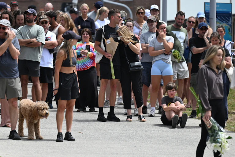 A crowd of mourners gathered at Bondi Beach.