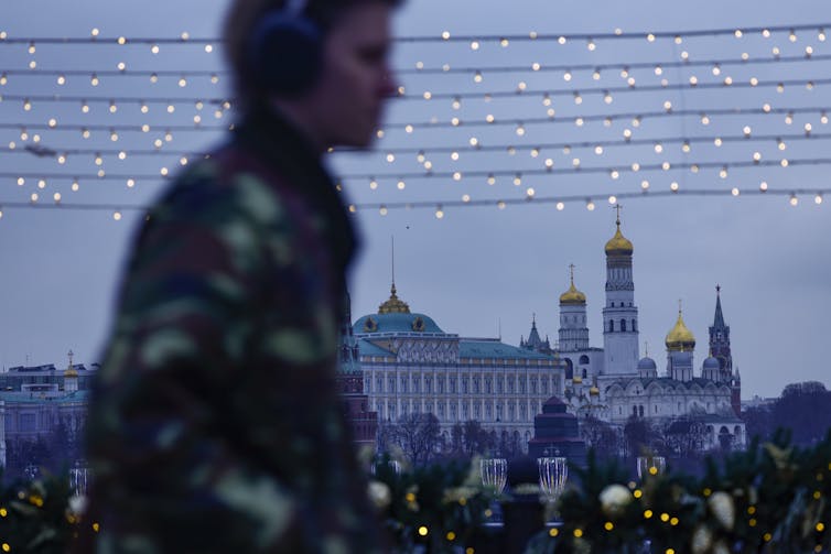Russia’s warfare economic system isn't collapsing, however nor is it solid 1 A man walks in front of the Kremlin.