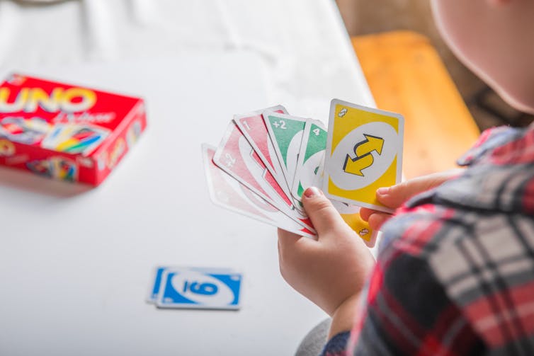 Boy playing Uno