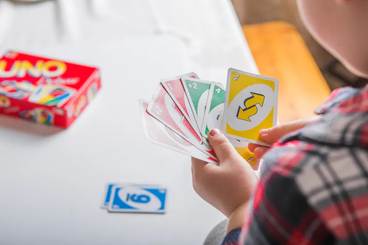 Boy playing Uno