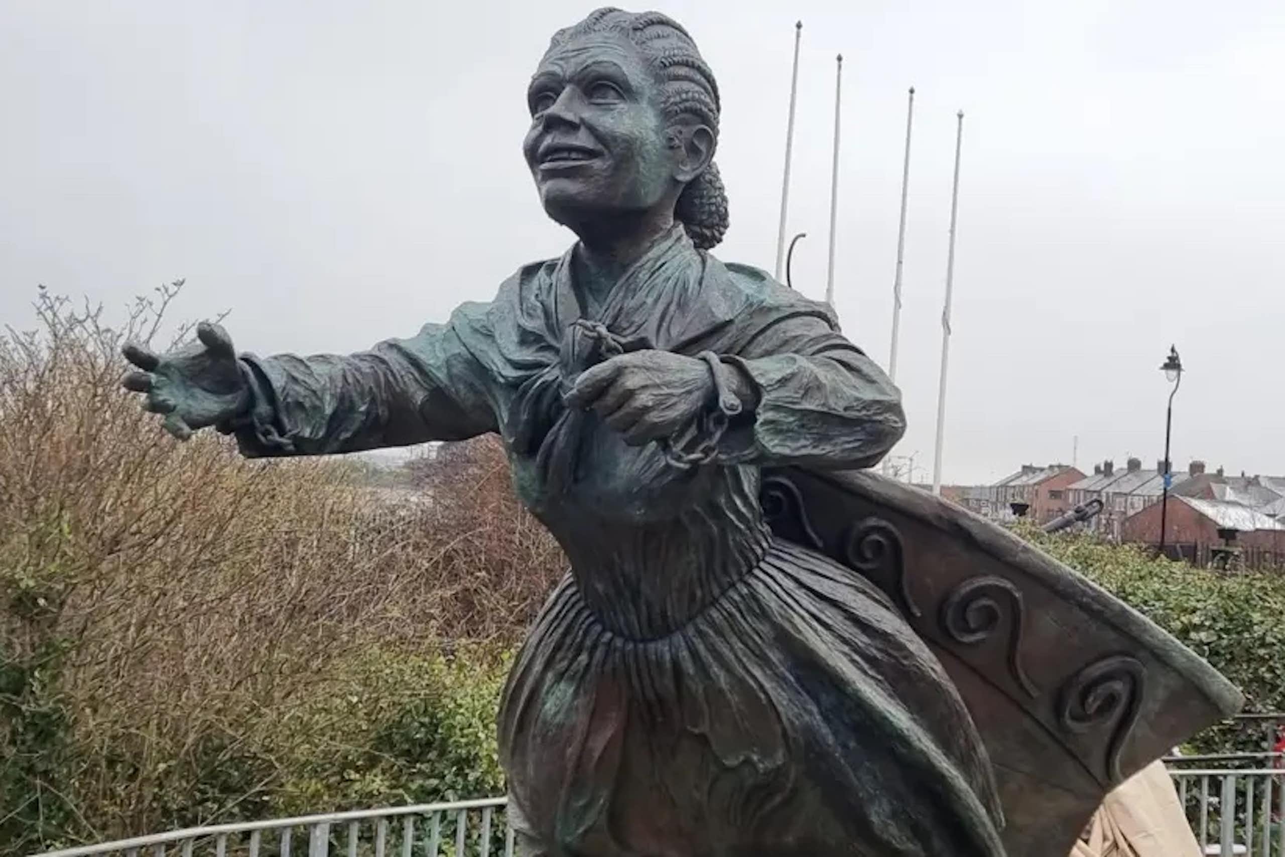 A statue of a Victorian woman with braided hair
