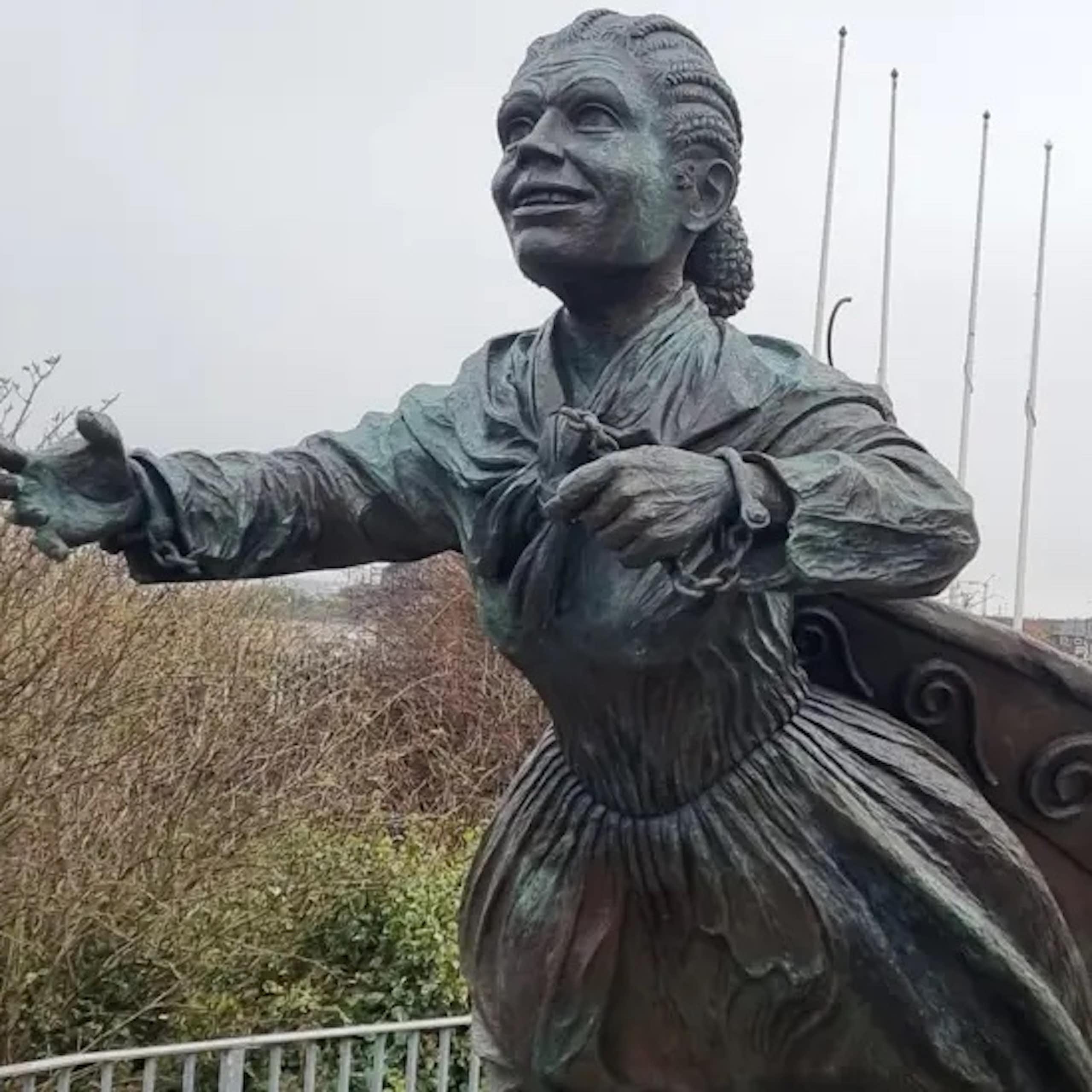 A statue of a Victorian woman with braided hair