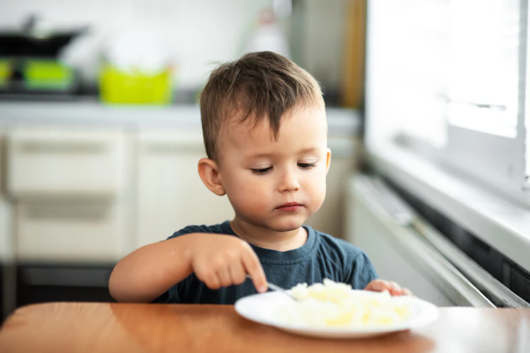 Child eating rice