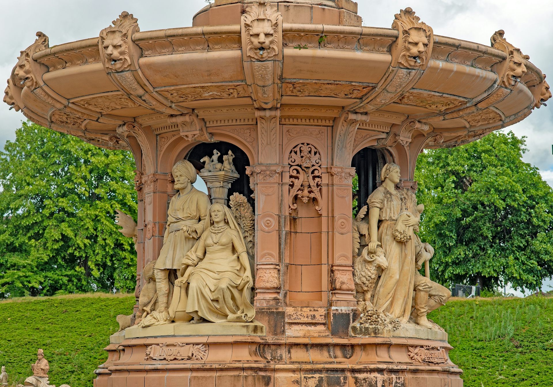 Detailing on the Doulton fountain showing men and women with farm animals.