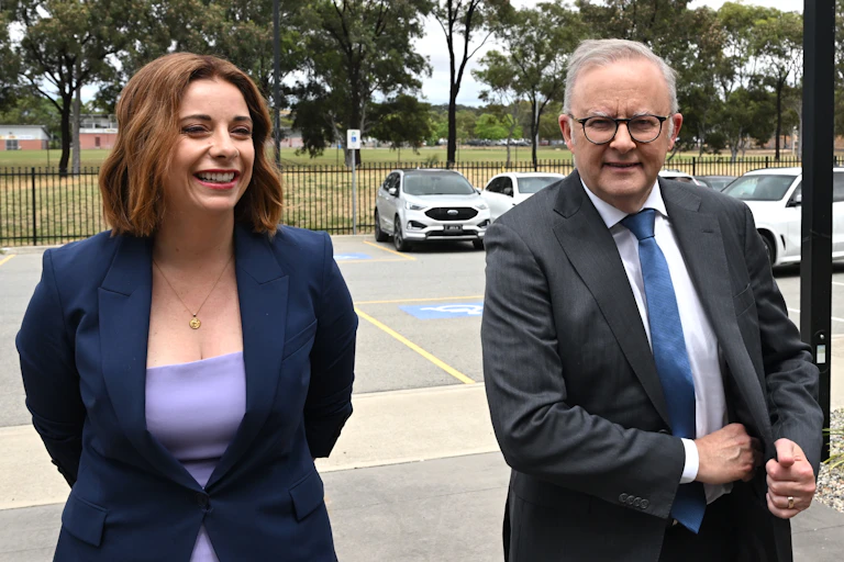 Anika Wells smiling next to Anthony Albanese