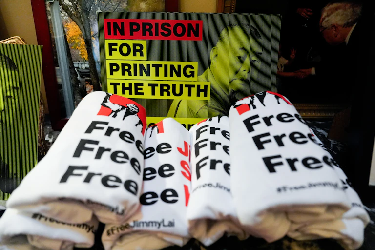 Merchandise in support of Jimmy Lai is displayed before a news conference