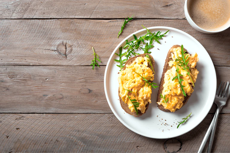 Scrambled eggs on wholewheat bread.