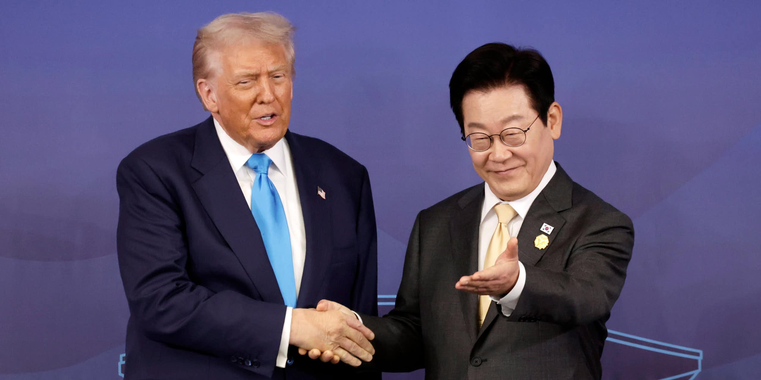 Lee Jae Myung gestures for Donald Trump to take a seat.