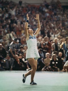 Tennis is about for a ‘Battle of the Sexes’ sequel – with out a motion in the back of it 1 Young woman raises her hands in celebration on a tennis court before a large crowd.