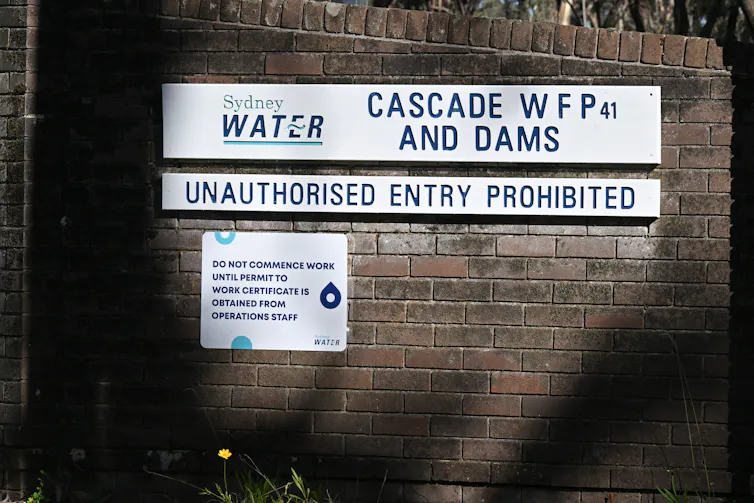 signs outside a water treatment plant.