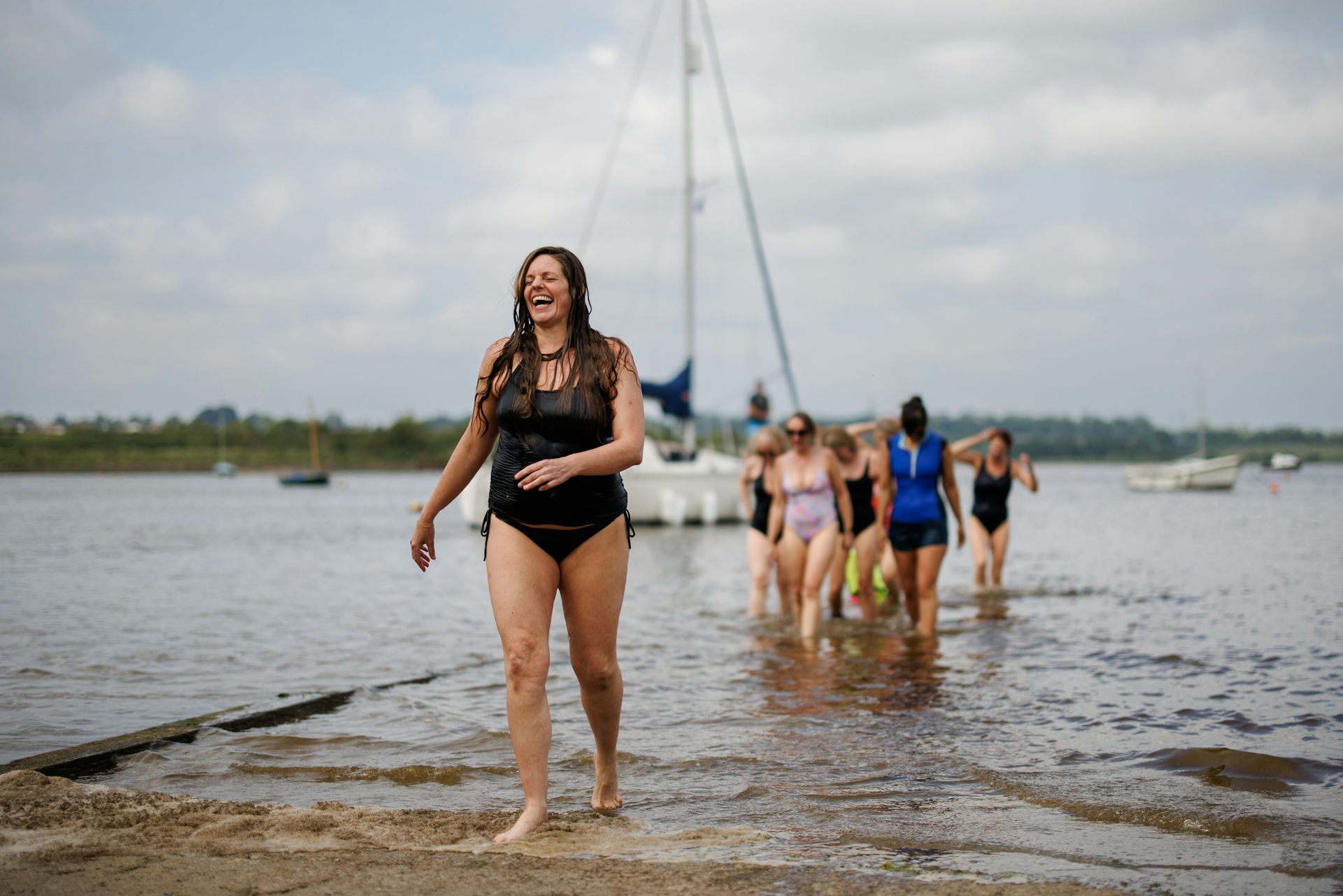 Members of the Manningtree Mermaids wild swimming group, coming out the water.
