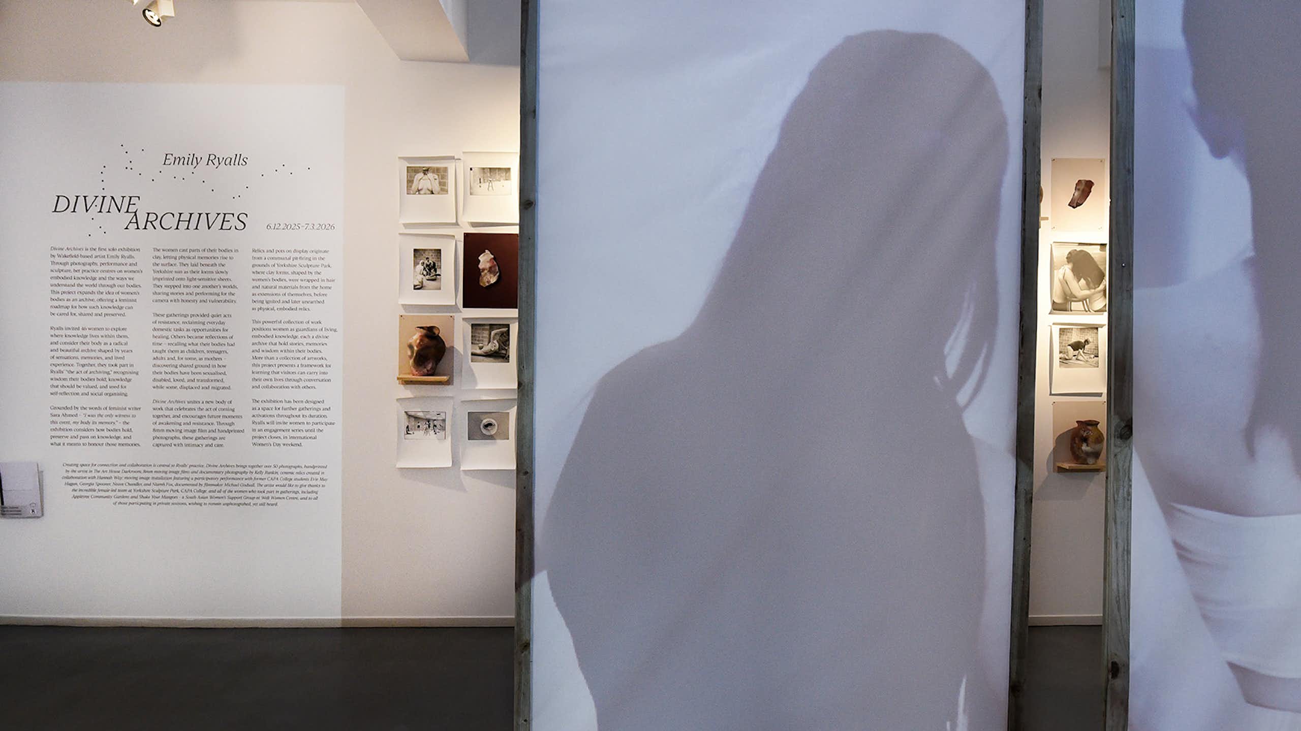 Inside of an exhibition space showing writing on the wall
