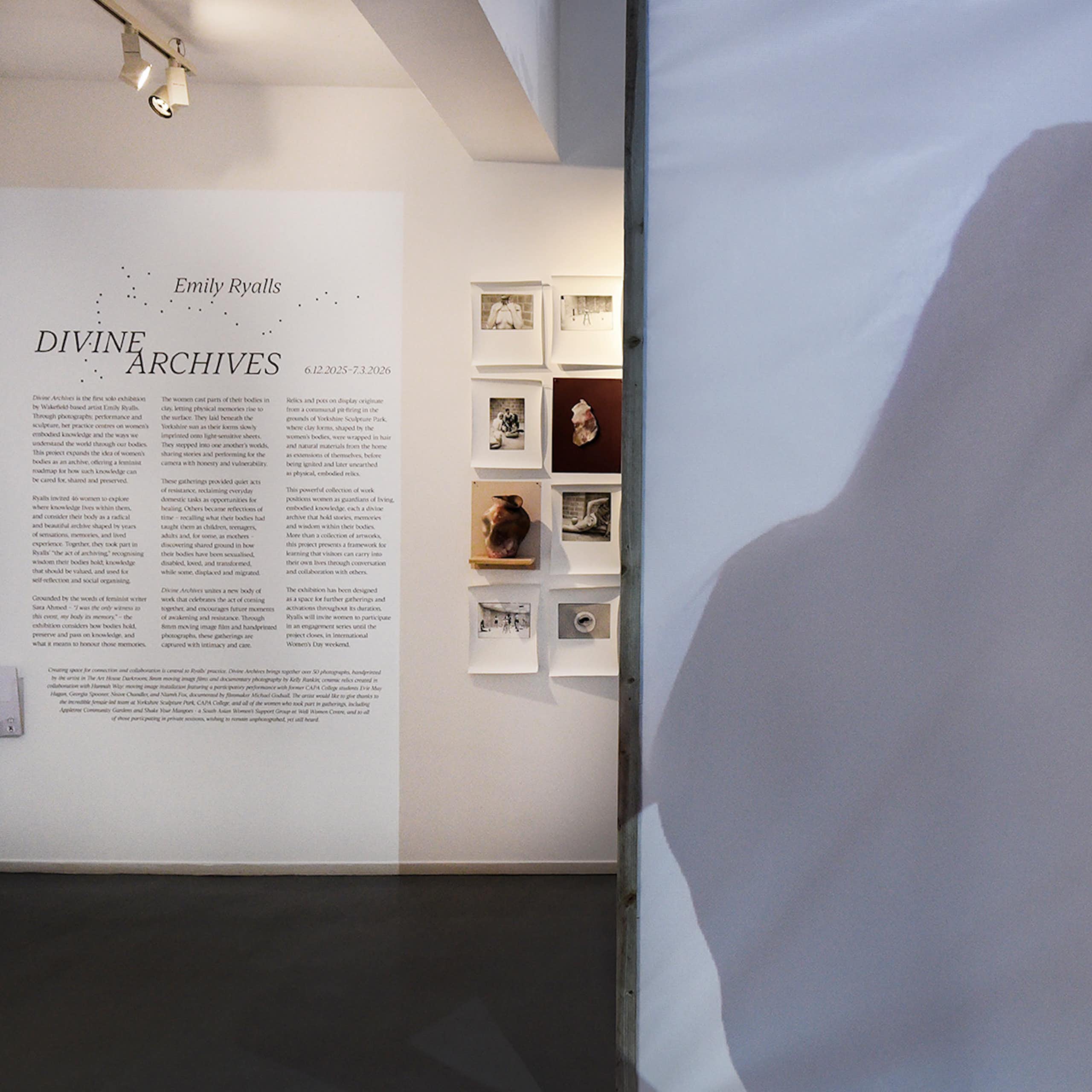 Inside of an exhibition space showing writing on the wall