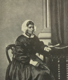 A photo of a black woman in Victorian clothing