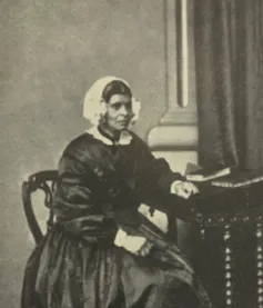 A photo of a black woman in Victorian clothing