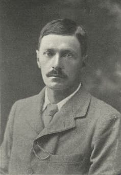 E. F. Benson in a suit, with a moustache