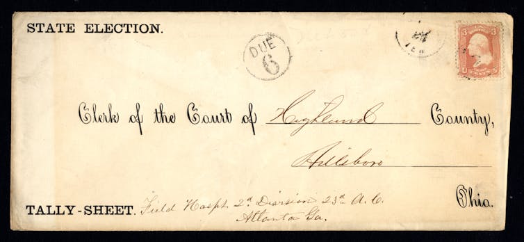 Yellowed postmarked envelope with state election and tally-sheet labels and a clerk-of-the-court address
