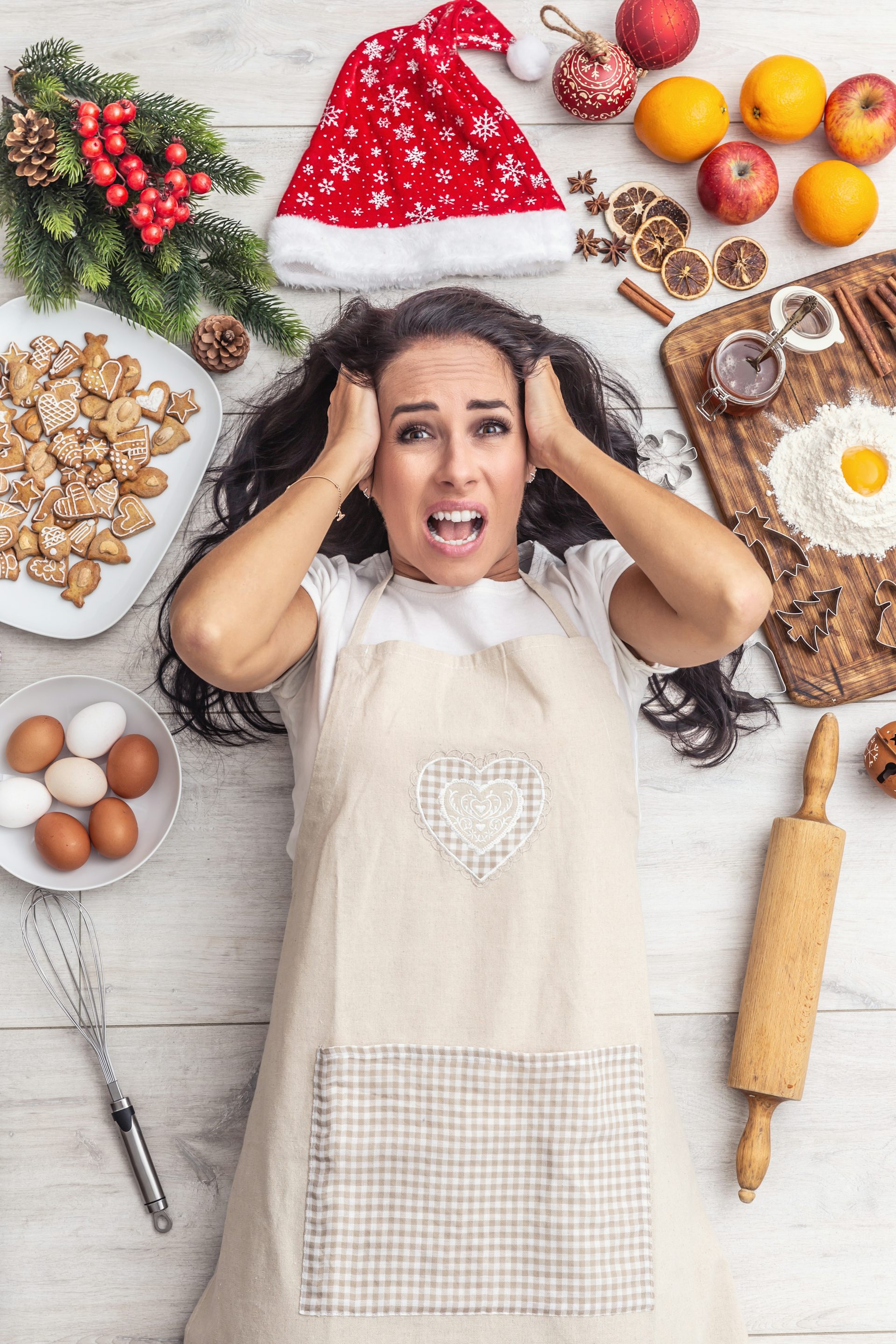 Stressed woman surrounded by Christmas baking