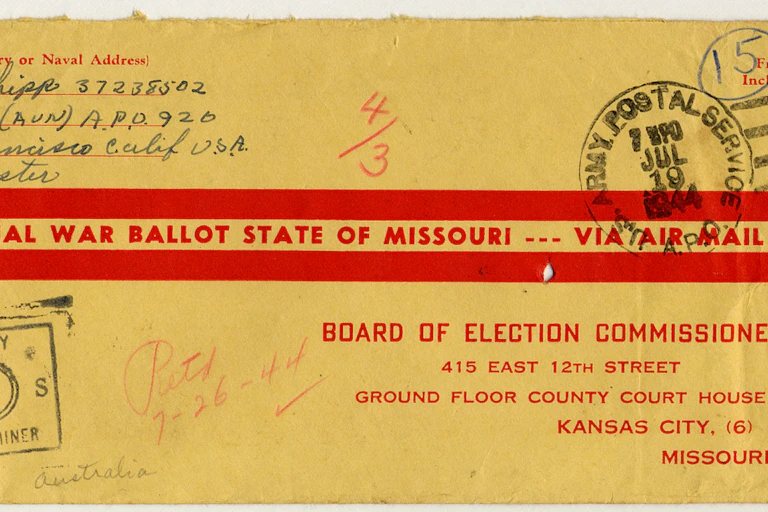 Yellowed postmarked envelope addressed to the board of election commissioners in Kansas city Missouri and labeled official war ballot state of Missouri – via airmail