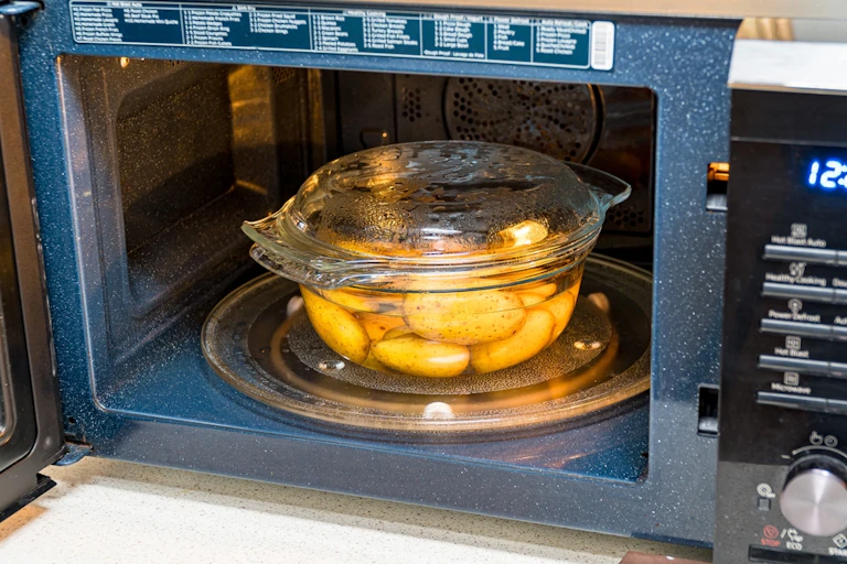 A glass dish in a microwave.