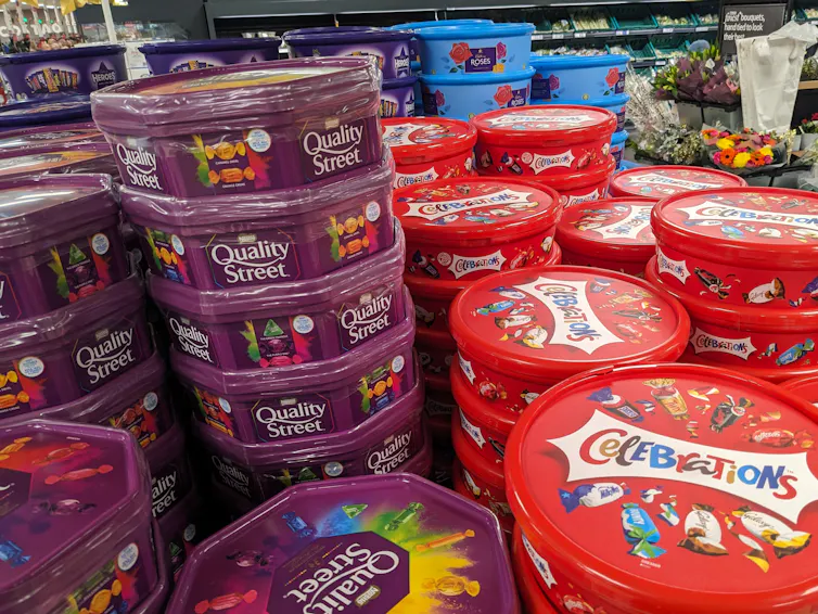 stacks of boxed chocolates on sale in a uk supermarket.