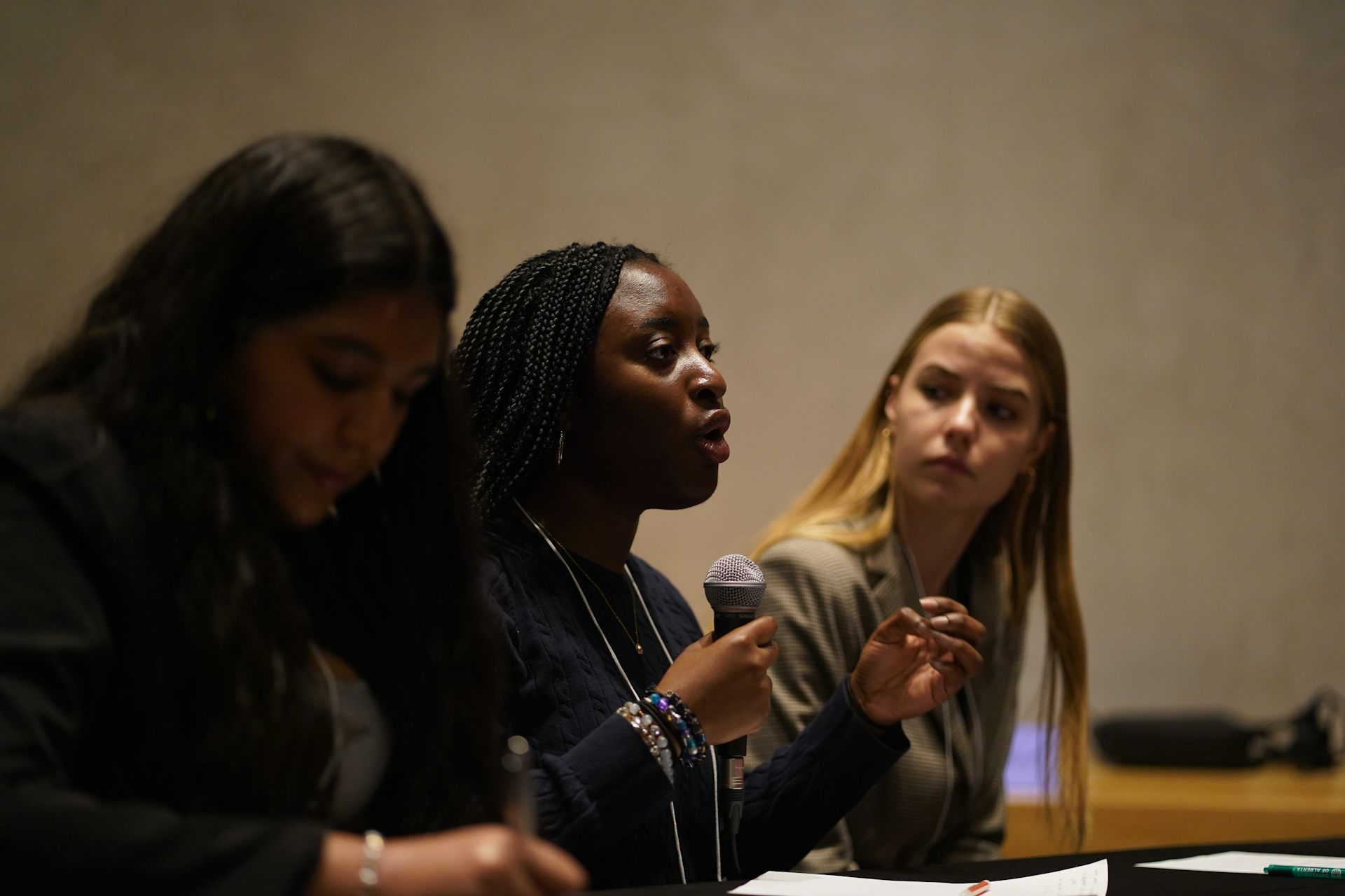 A person in discusson at a table.