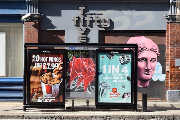 bus shelter with adverts for mcdonald's and kfc