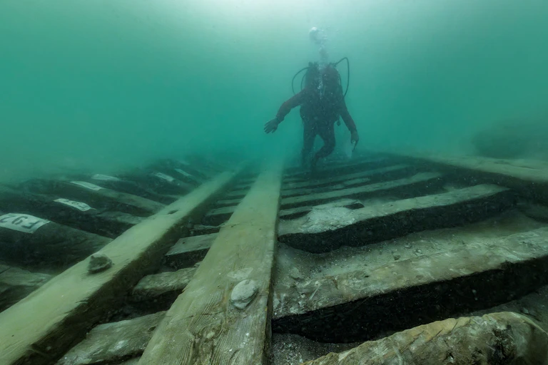 Divers examining the wreck.
