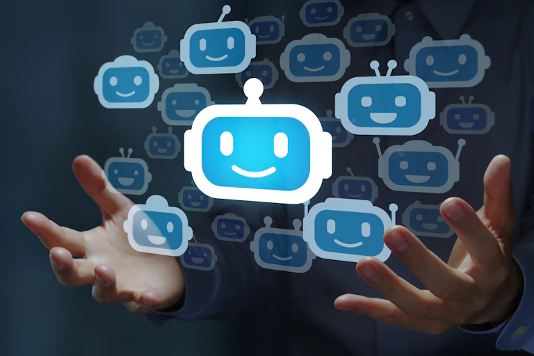 a couple dozen robot face emojis floating between two human hands