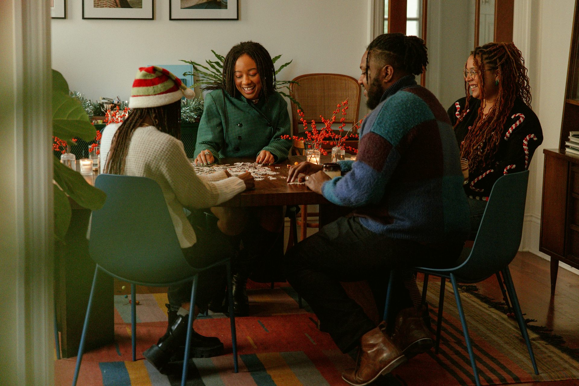 A group of people playing a board game during holidays.