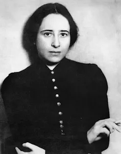 A black and white image of a 1930s young woman looking directly at the camera.