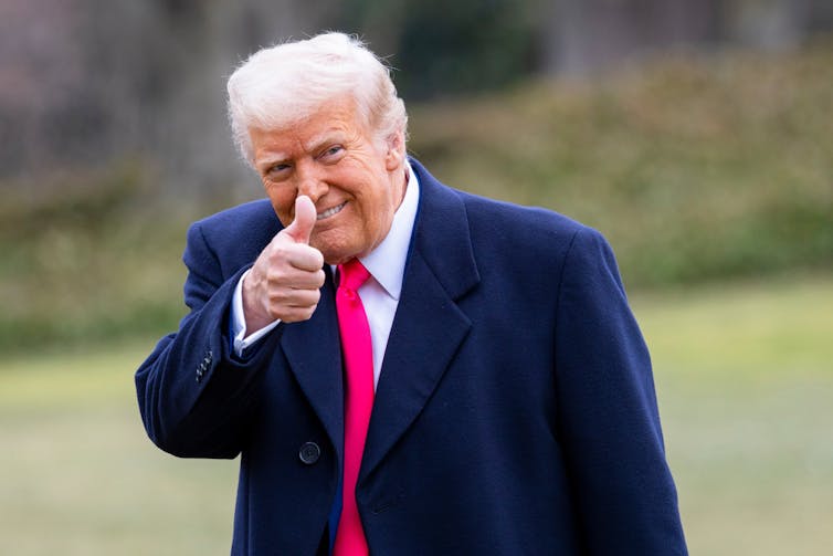 How Hannah Arendt can lend a hand us perceive this new age of far-right populism 2 Strange-looking orange-faced old man with thumbs up and a red tie that goes down to his knees.