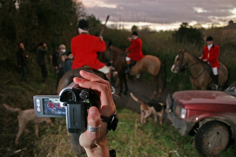 Meet these days’s hunt saboteurs – ‘doctors, teachers, even farmers’ operating with police to deliver unlawful fox hunts to justice 3 Members of the South Herefordshire Hunt on horseback are filmed by a hunt saboteur