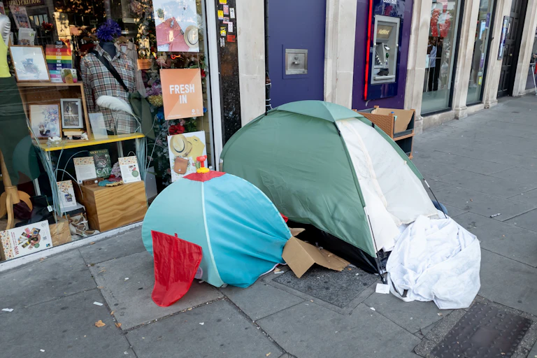 An adult and child sized tent on a street in the UK