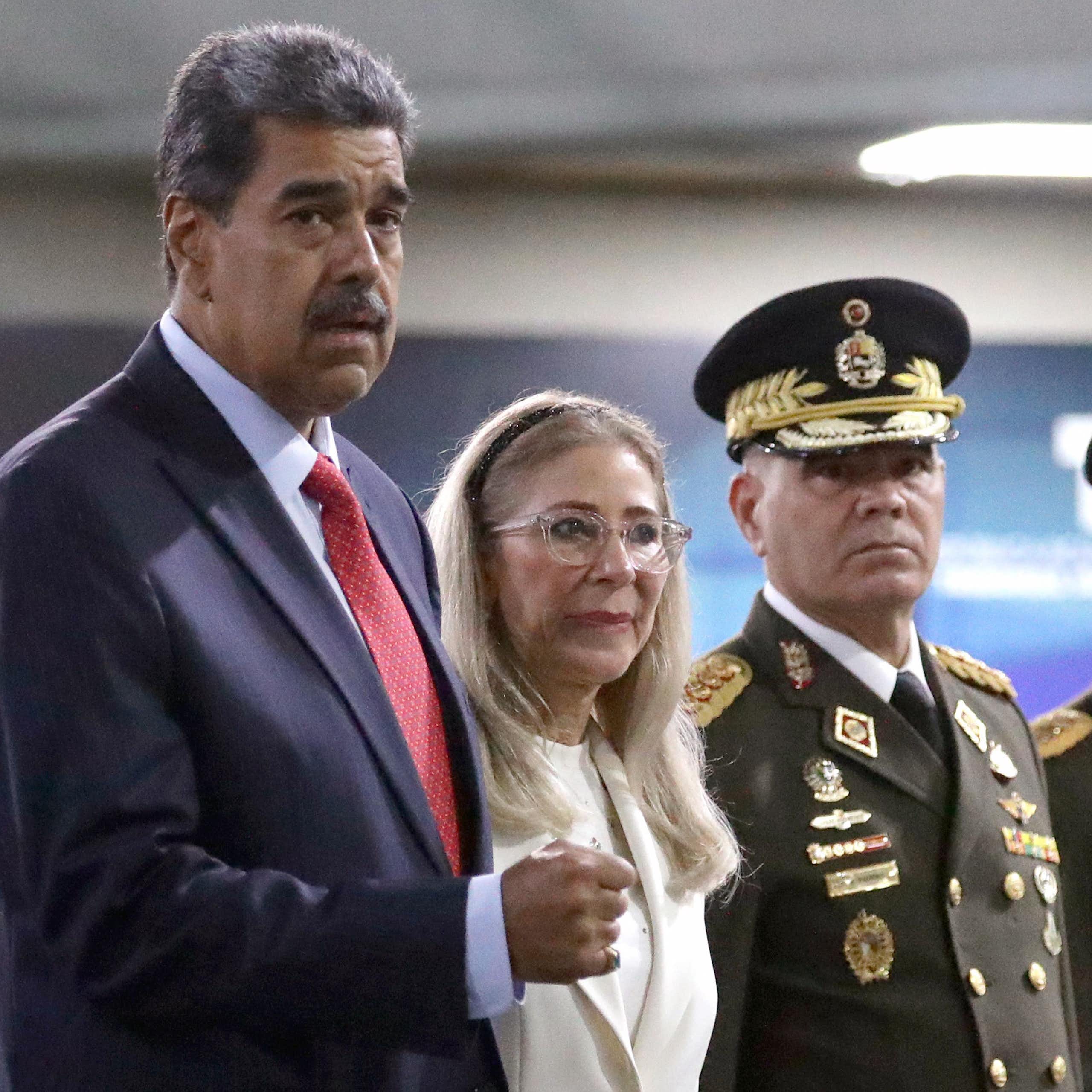 Nicolás Maduro and his wife arriving at a court in Caracas.