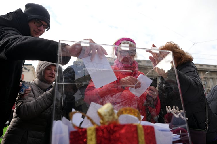 Students at a protest signing documents