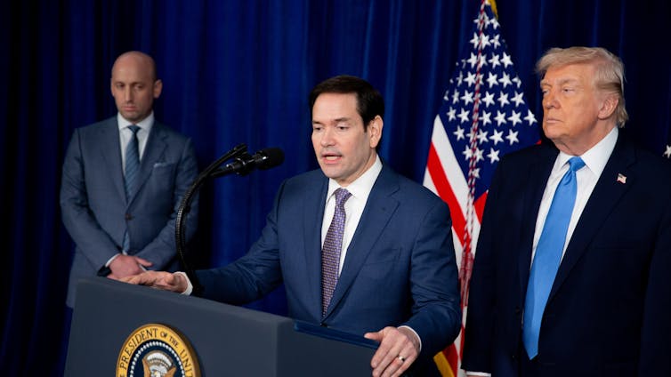 Marco Rubio speaks during a news conference alongside Donald Trump.