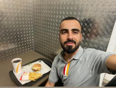 Man takes selfie in McDonalds