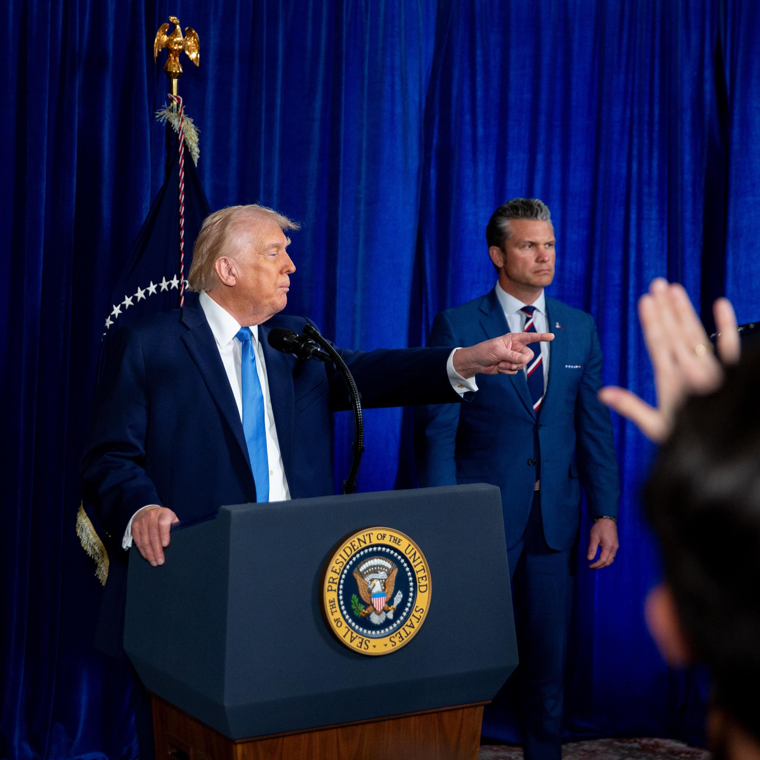 Marco Rubio, Donald Trump,and US Secretary of Defense Pete Hegseth at a news conference at the Mar-a-Lago Club, Florida.