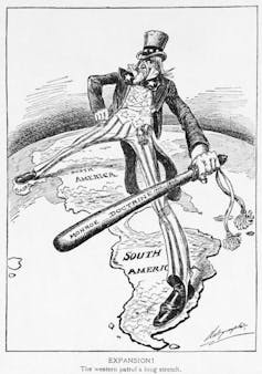 Cartoon of Uncle Sam Straddling the Americas.