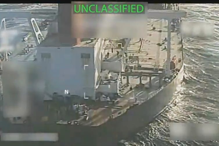 A video still shows an oil tanker.