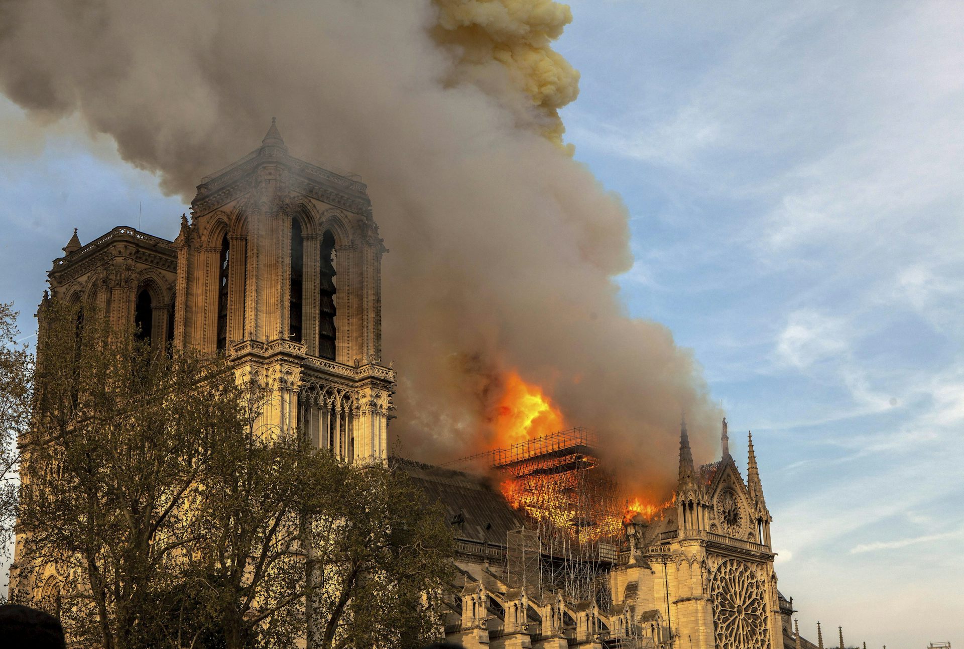 A large cathedral building on fire