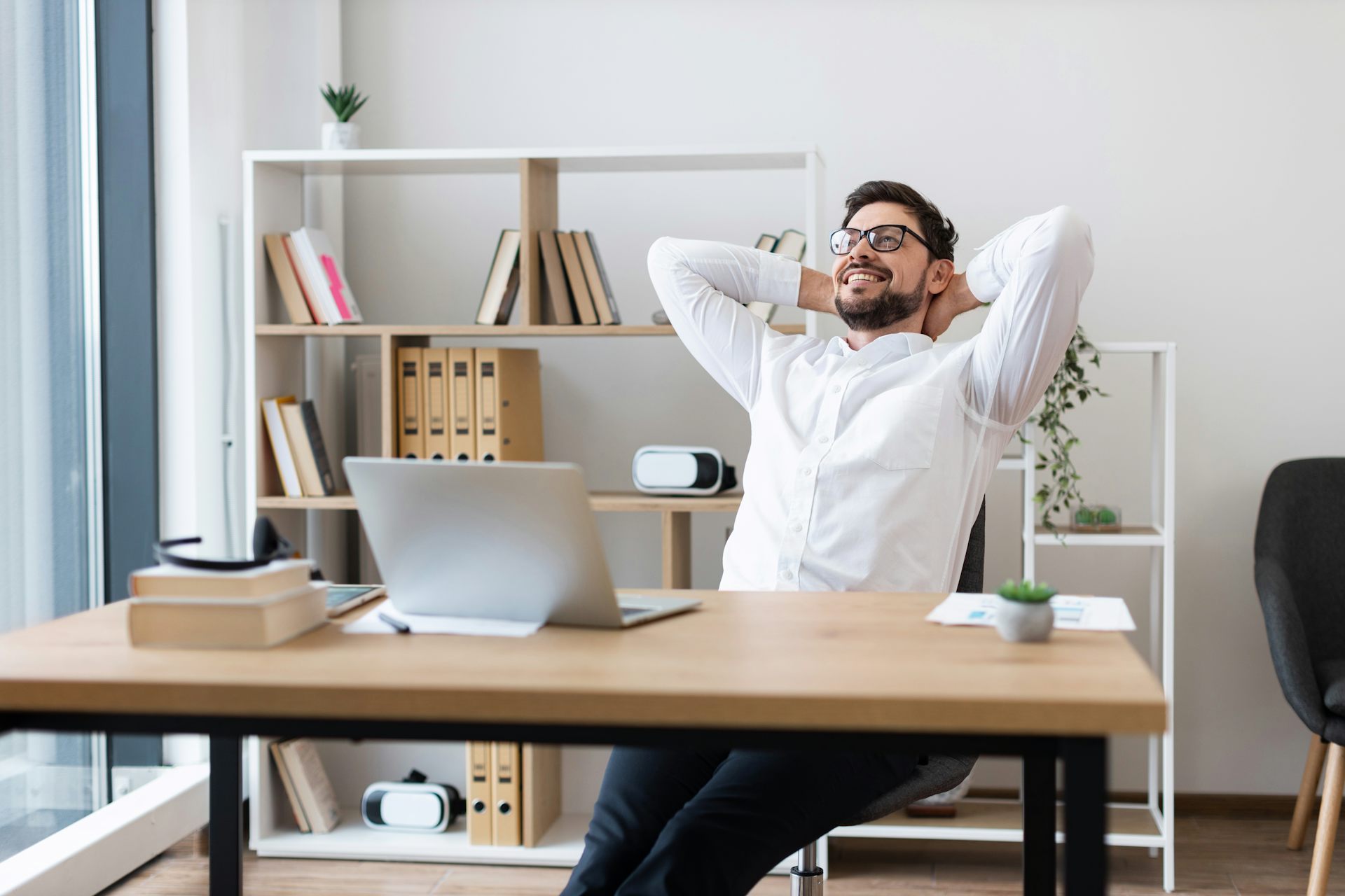 Man looking content at workspace.