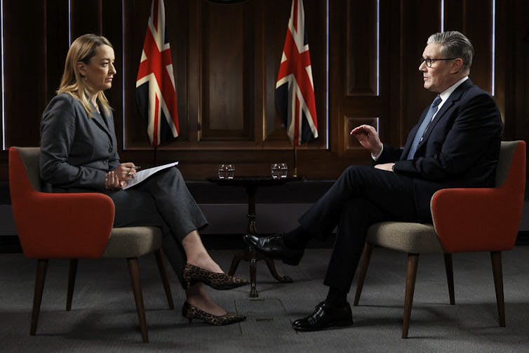 Laura Kuenssberg and Keir Starmer sitting opposite each other.
