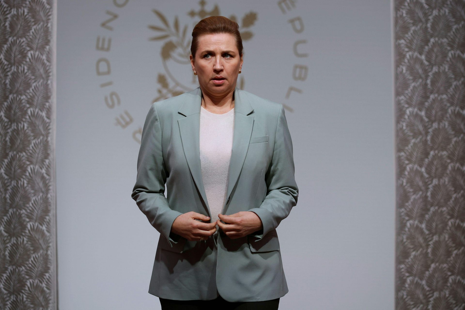 Danish prime minister Mette Frederiksen looking tense.