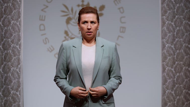 Danish prime minister Mette Frederiksen looking tense.