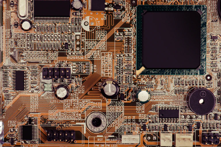 A close-up of an electrical circuit panel from the inside of a computer.
