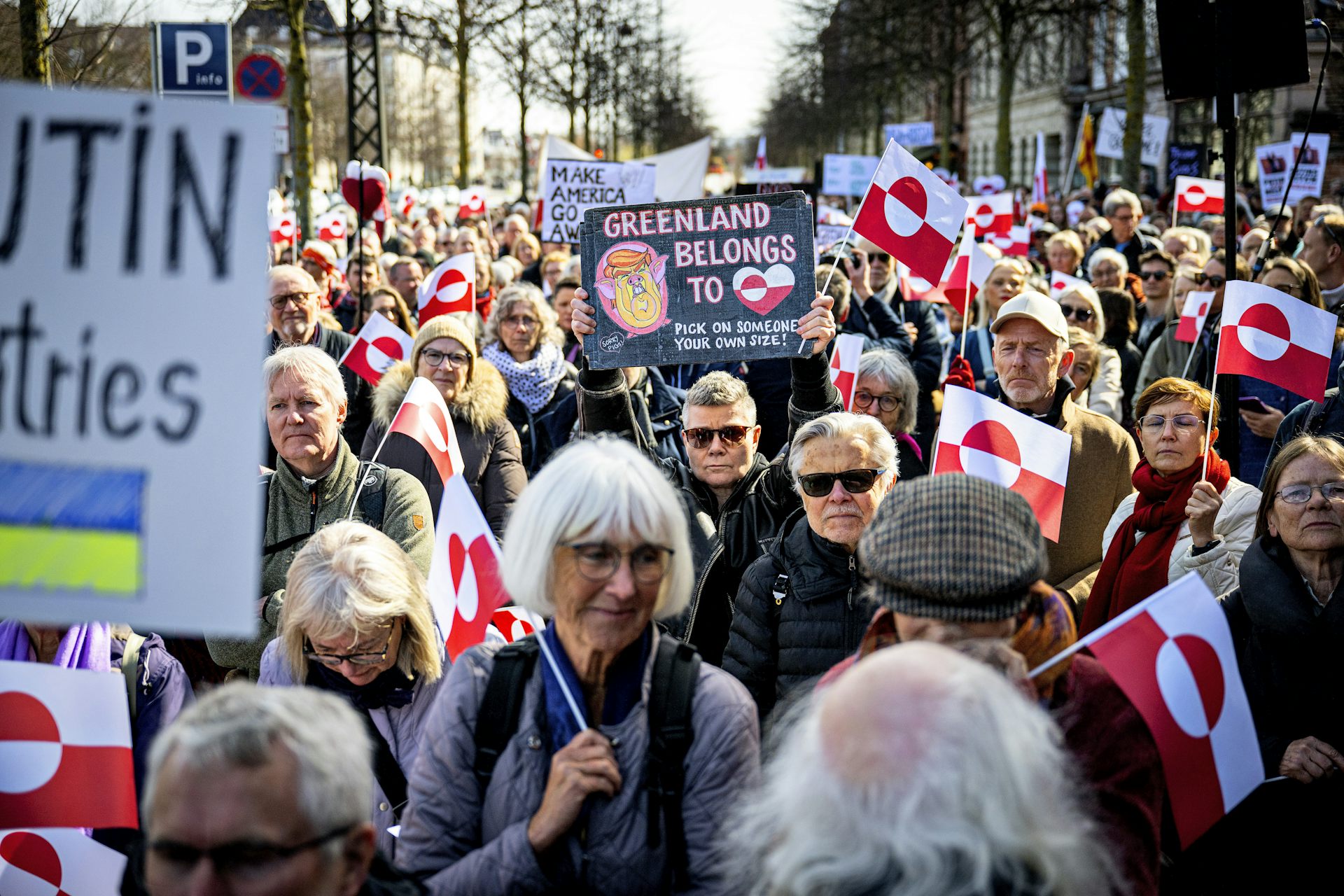 Demonstrators hold Greenland flags as they protest in front of the US embassy, in Copenhagen.