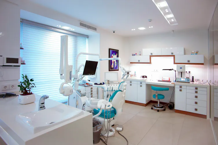 Dentist chair in an empty treatment room.